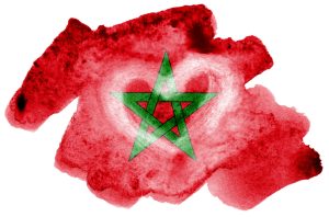 Morocco flag  is depicted in liquid watercolor style isolated on white background. Careless paint shading with image of national flag. Independence Day banner